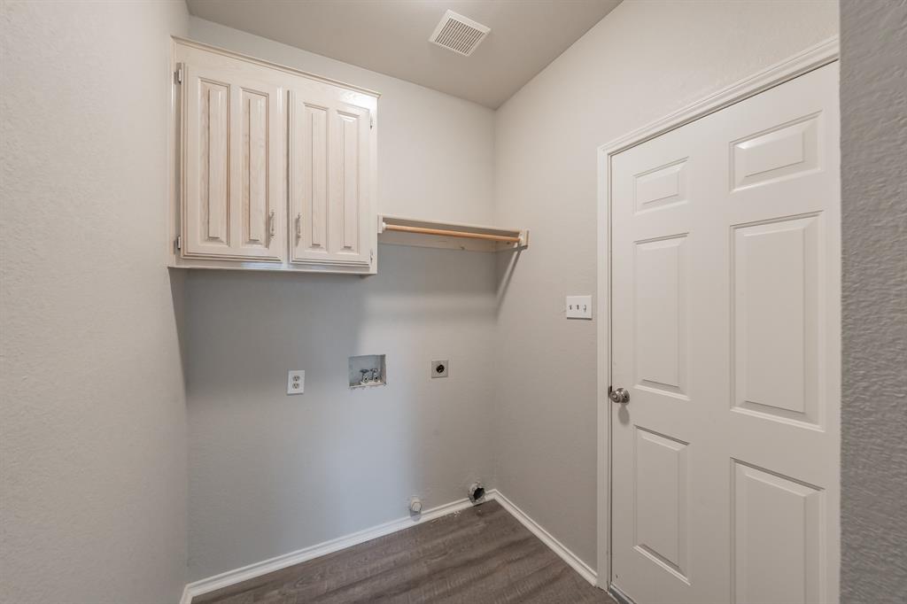 1803 Haydenbend Circle Grapevine, TX 76051 - Photo 34 of 40 Laundry area with space for full size washer & dryer leads to the two car garage.