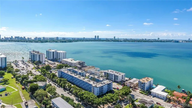 a view of a lake with a house in the background