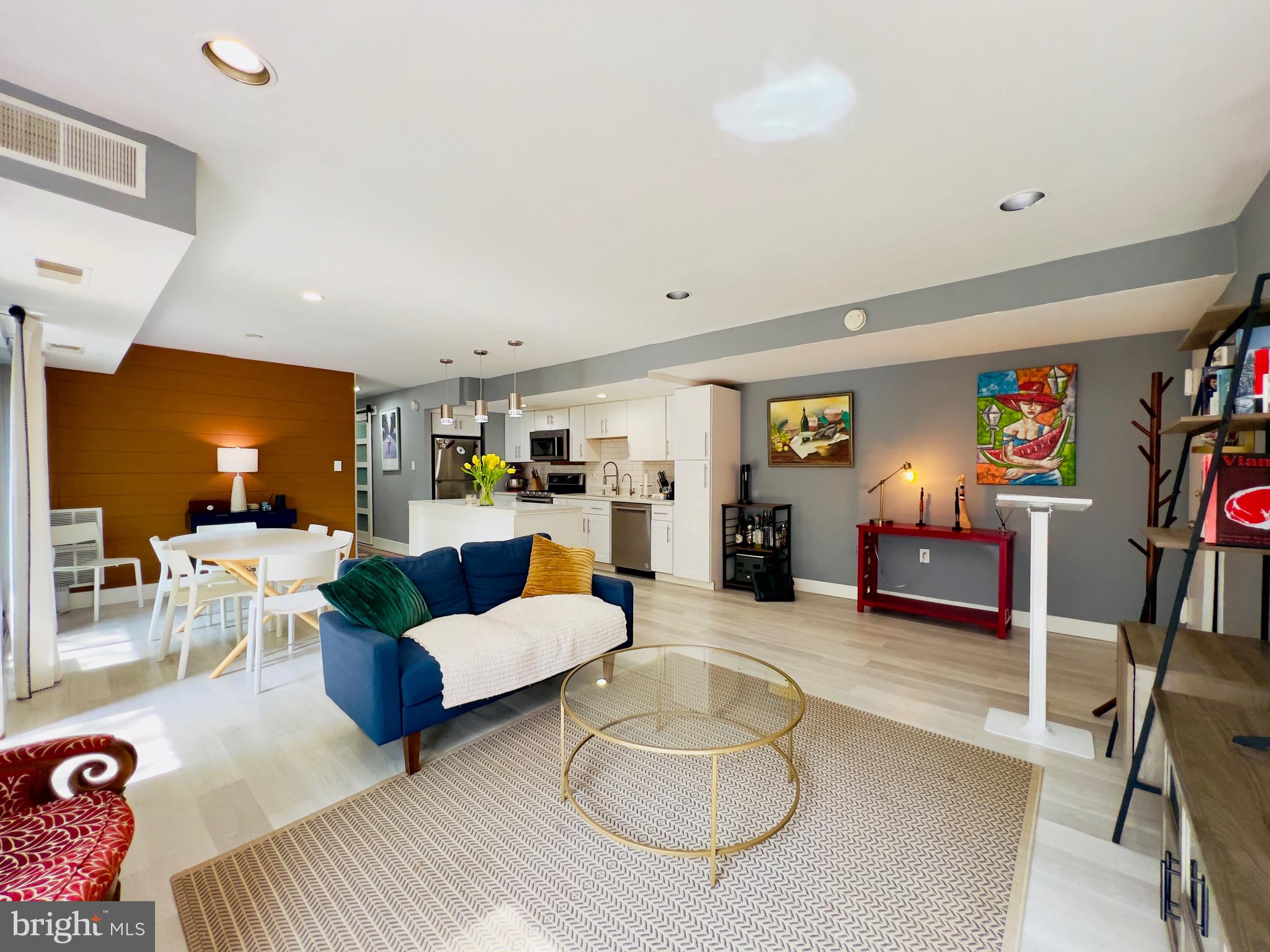 12311 Braxfield Court, Unit 425 Rockville, MD 20852 - Photo 5 of 22 a living room with furniture and a wooden floor