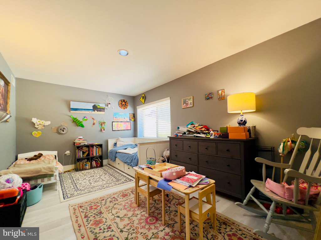 12311 Braxfield Court, Unit 425 Rockville, MD 20852 - Photo 10 of 22 a living room with furniture and a wooden floor