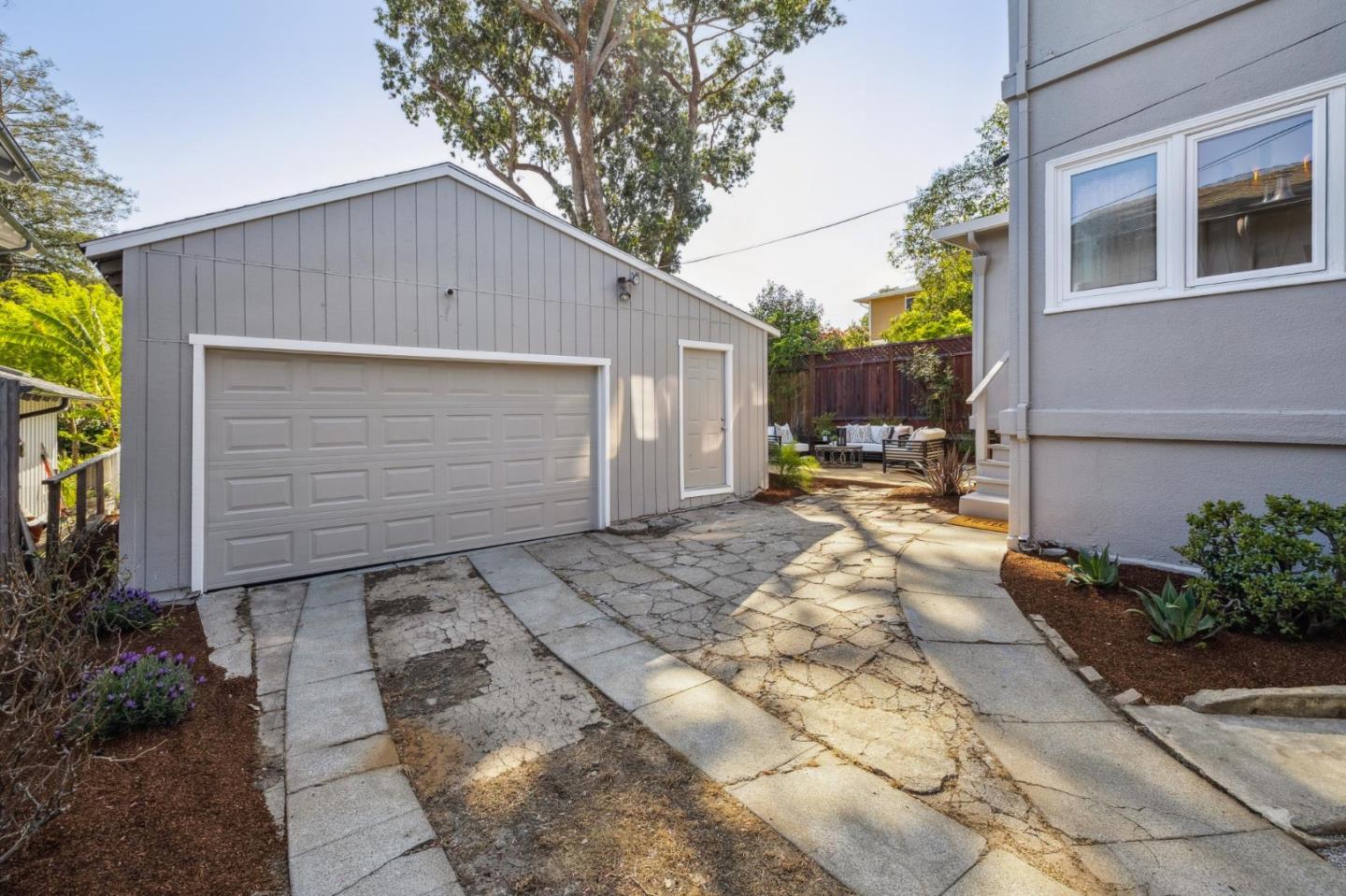 829 Edgehill Drive Burlingame, CA 94010 - Photo 60 of 99 a backyard of a house with sitting area and garage