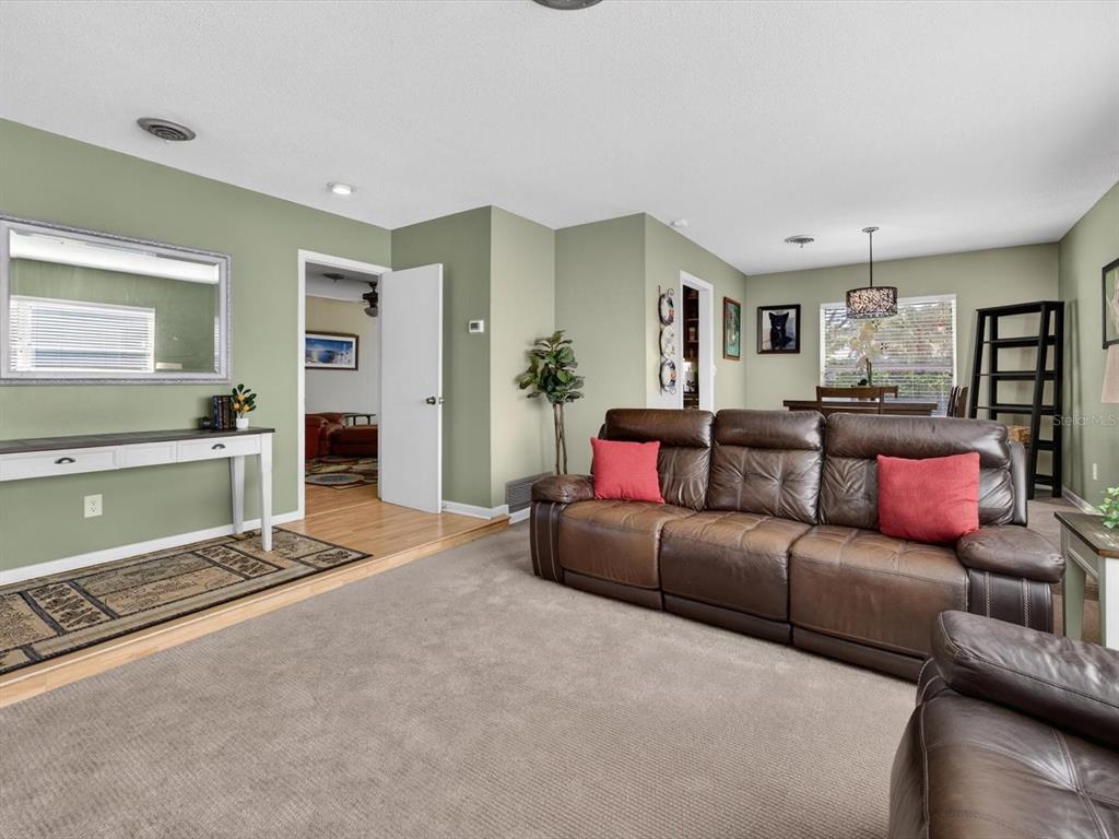 2803 Banchory Road Winter Park, FL 32792 - Photo 2 of 31 a living room with a couch and a view of kitchen