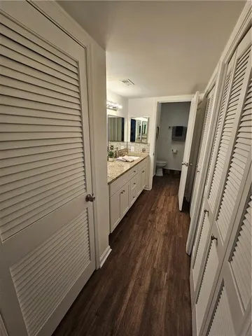 a bathroom with a sink and mirror
