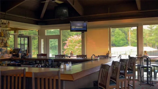 a view of a dining room with furniture window and outside view