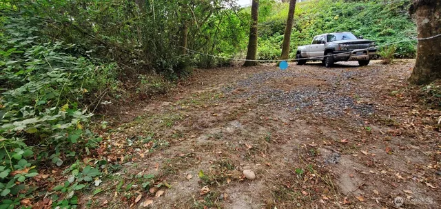 a view of a backyard with sitting area