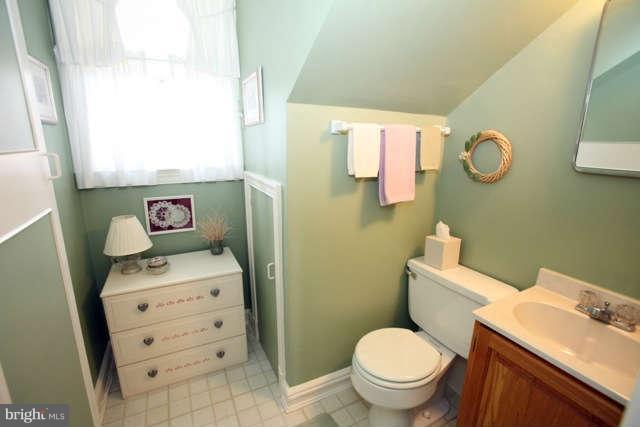 302 Worthington Road Baltimore, MD 21286 - Photo 15 of 24 a bathroom with a toilet sink vanity and mirror