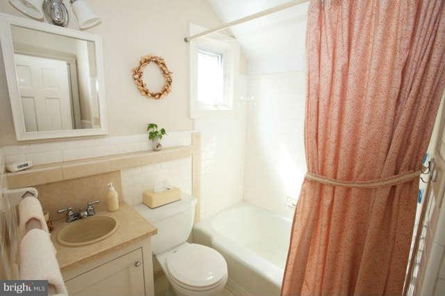 302 Worthington Road Baltimore, MD 21286 - Photo 17 of 24 a white toilet sitting next to a bathroom sink