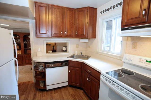 302 Worthington Road Baltimore, MD 21286 - Photo 6 of 24 a kitchen with stainless steel appliances granite countertop a sink stove and cabinets