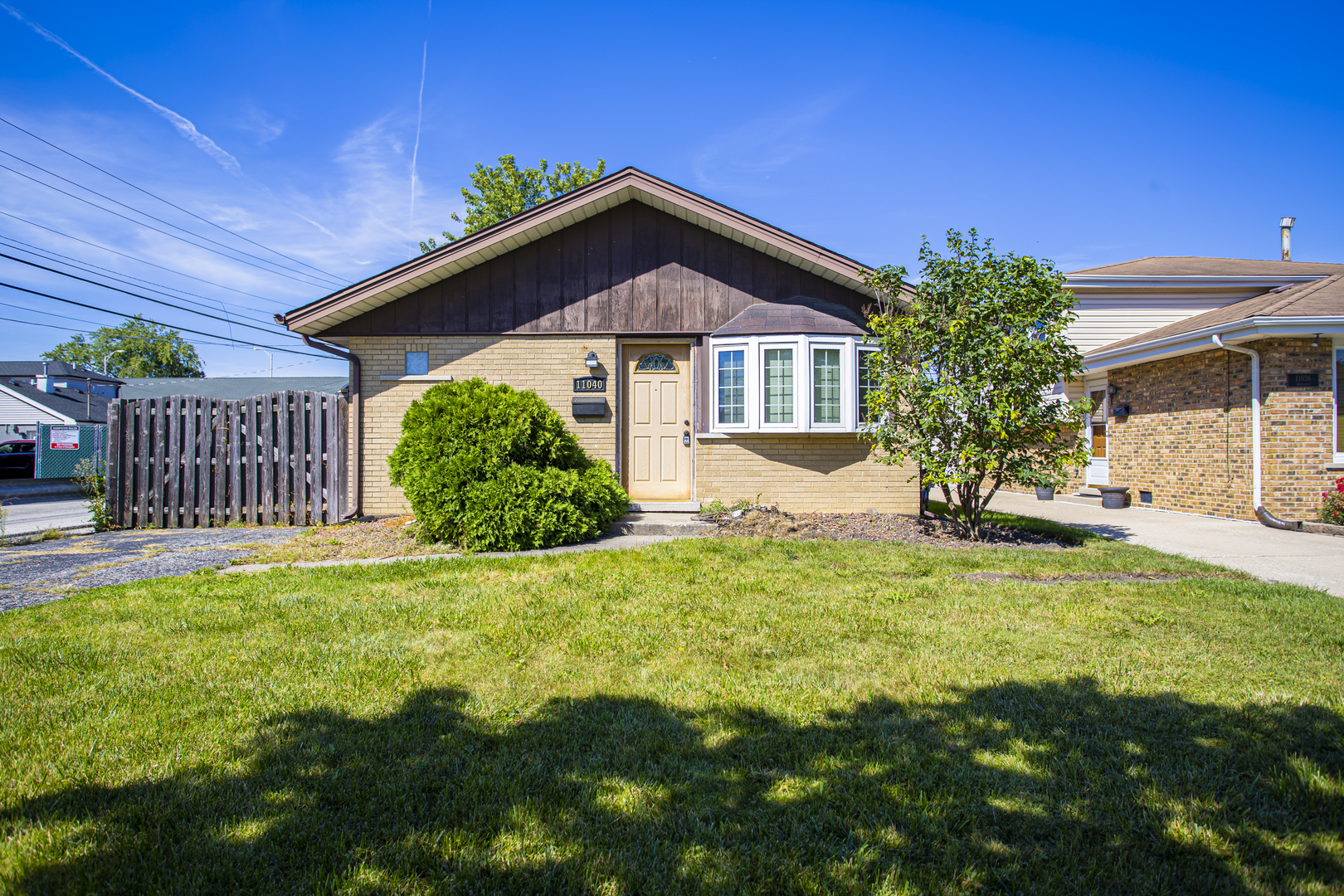 11040 Massasoit Avenue Chicago Ridge, IL 60415 - Photo 1 of 23 a front view of a house with a yard