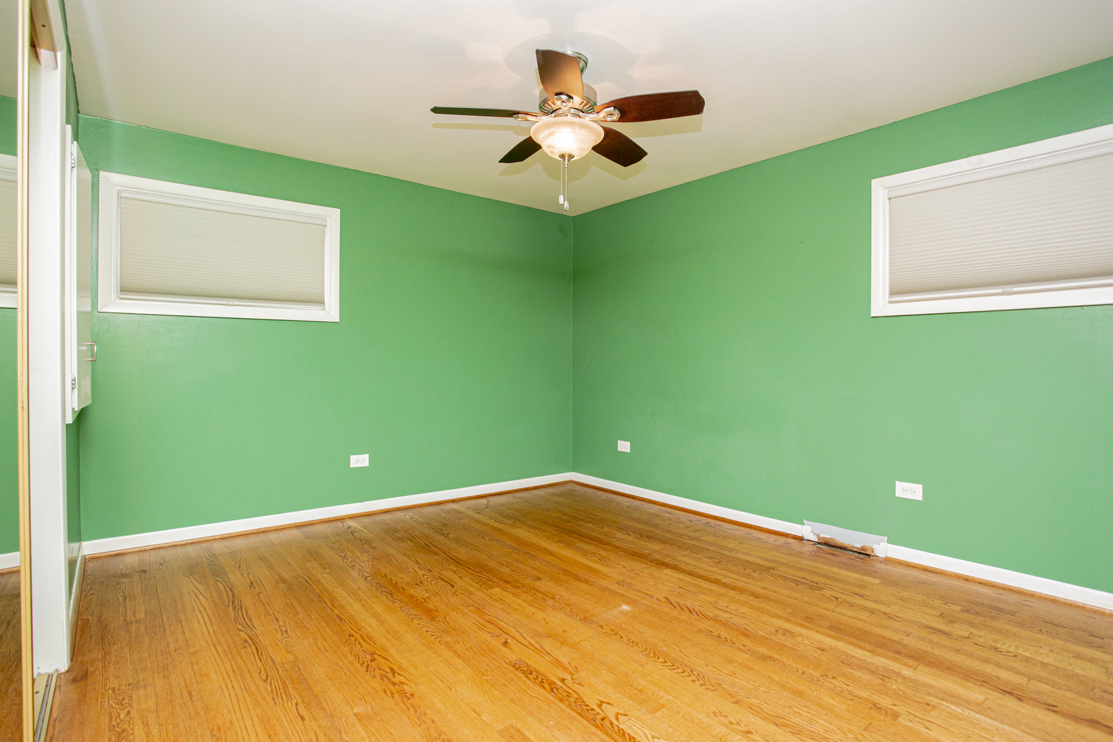 11040 Massasoit Avenue Chicago Ridge, IL 60415 - Photo 16 of 23 a view of a big room with wooden floor and a ceiling fan