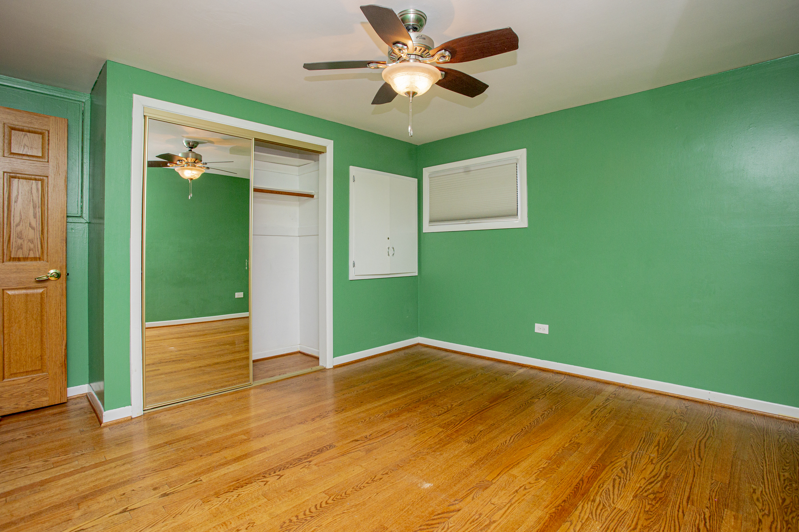 11040 Massasoit Avenue Chicago Ridge, IL 60415 - Photo 17 of 23 a view of a big room with wooden floor and a ceiling fan
