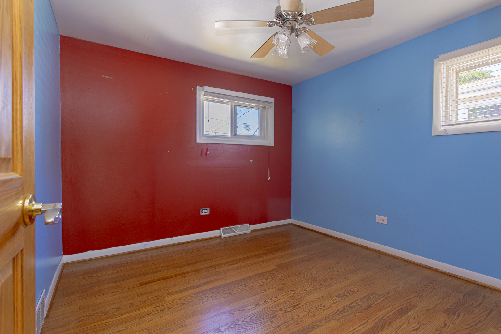 11040 Massasoit Avenue Chicago Ridge, IL 60415 - Photo 18 of 23 an empty room with wooden floor and windows