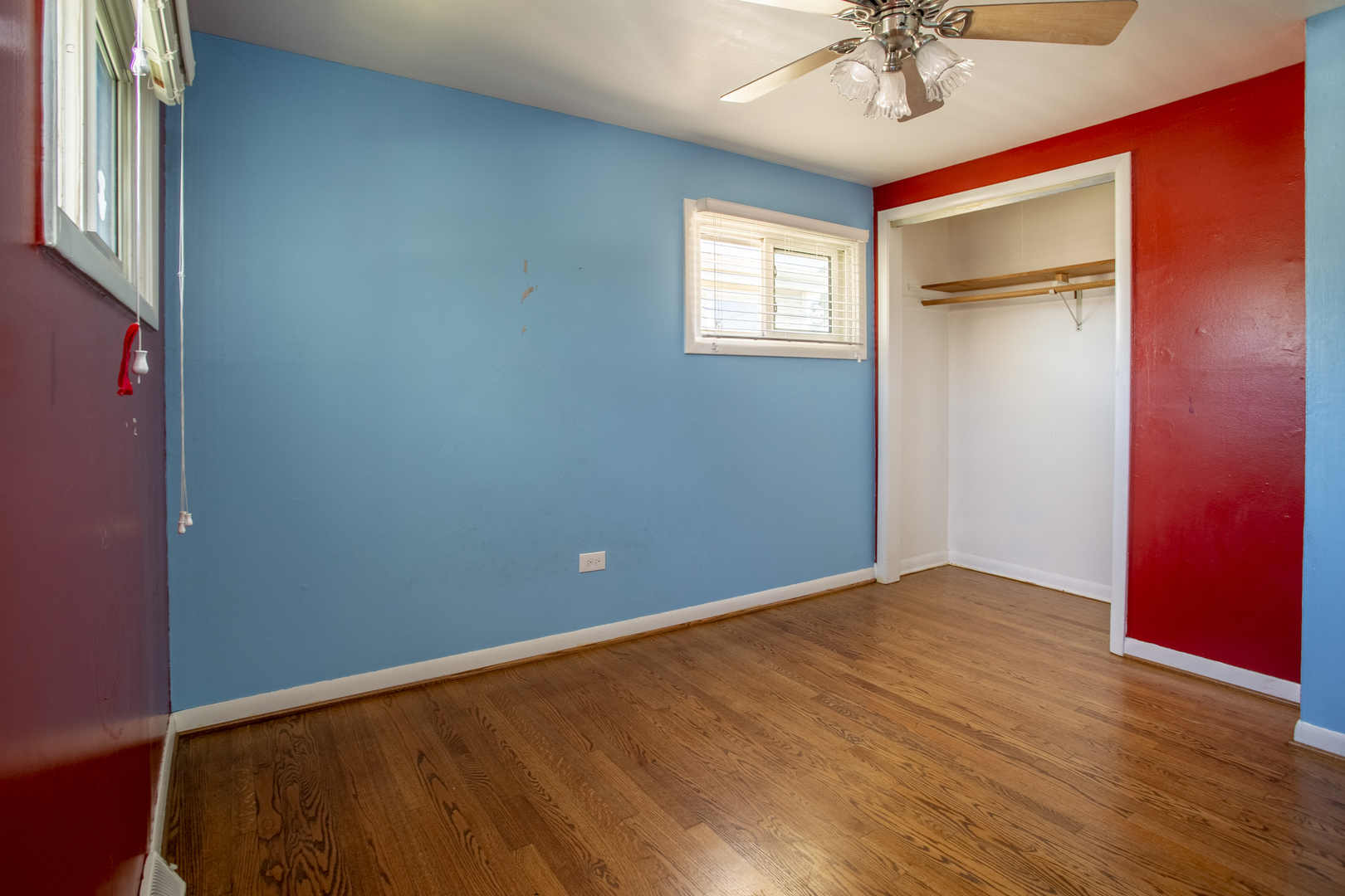 11040 Massasoit Avenue Chicago Ridge, IL 60415 - Photo 19 of 23 an empty room with a window and chandelier fan