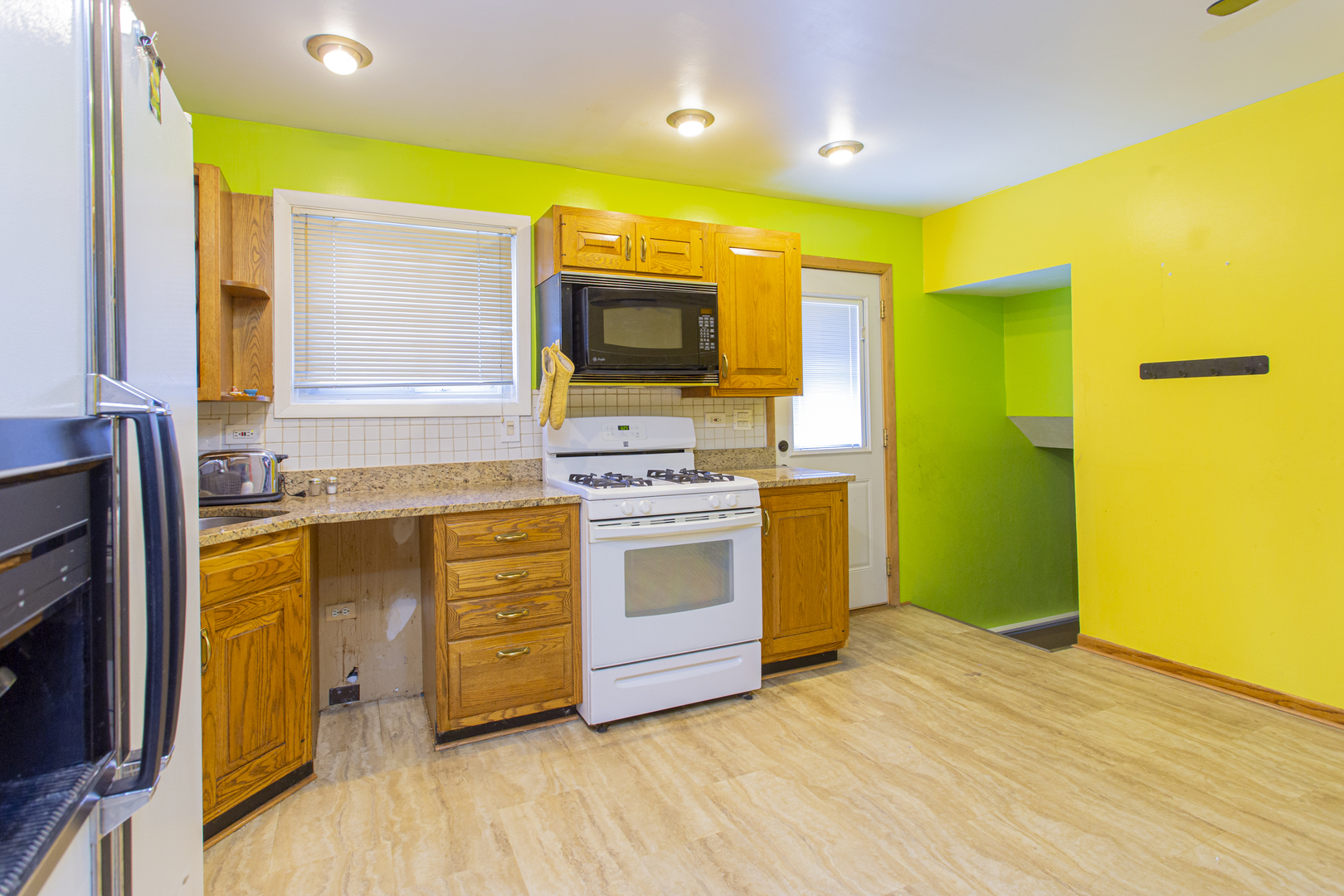 11040 Massasoit Avenue Chicago Ridge, IL 60415 - Photo 7 of 23 a kitchen with stainless steel appliances a stove top oven and sink