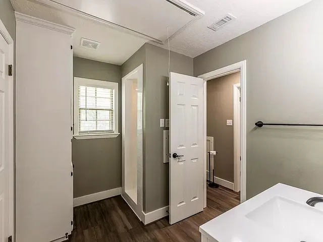 a view of a room with racks on the wall