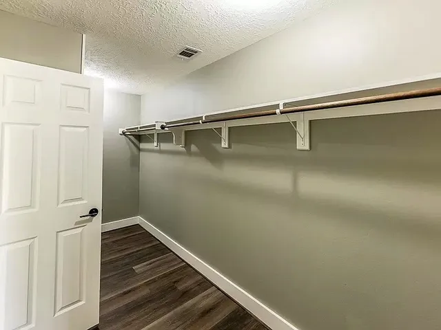 a bathroom with a double vanity sink a mirror and shower