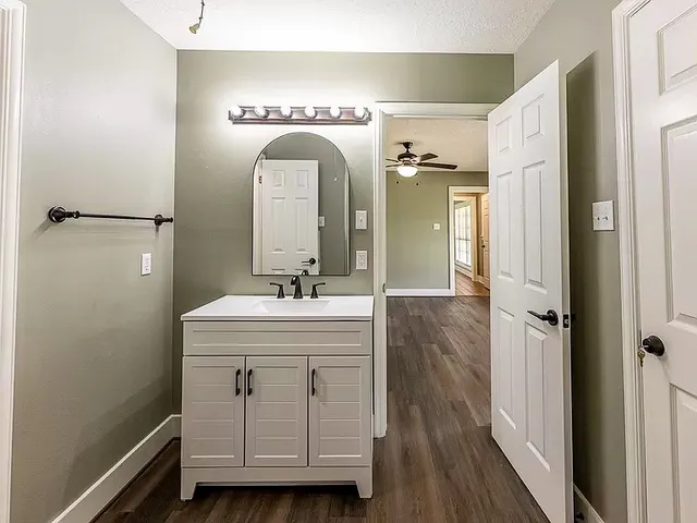 a view of a house with a backyard