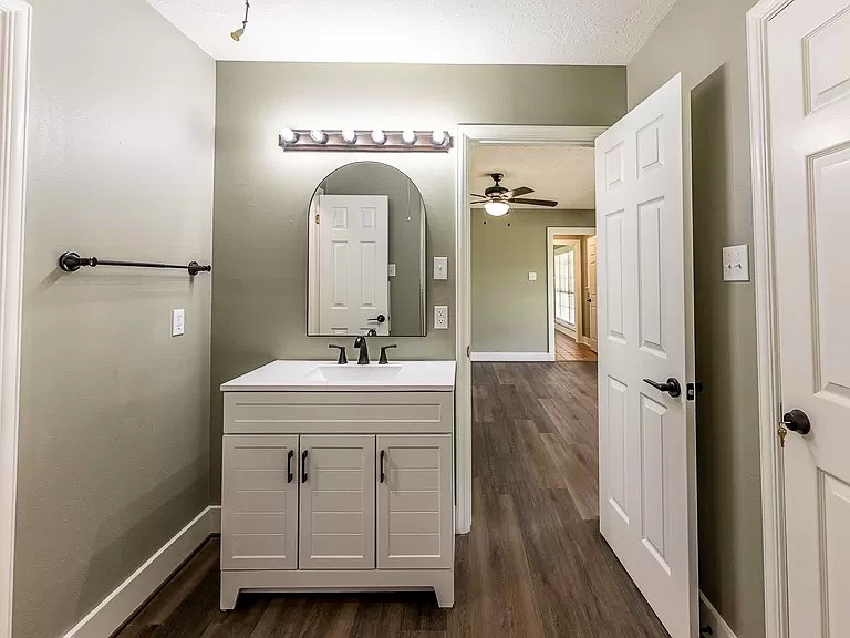 50 Neiderhoffer Subdivision Road Huntsville, TX 77340 - Photo 16 of 20 a bathroom with a double vanity sink and mirror with shower