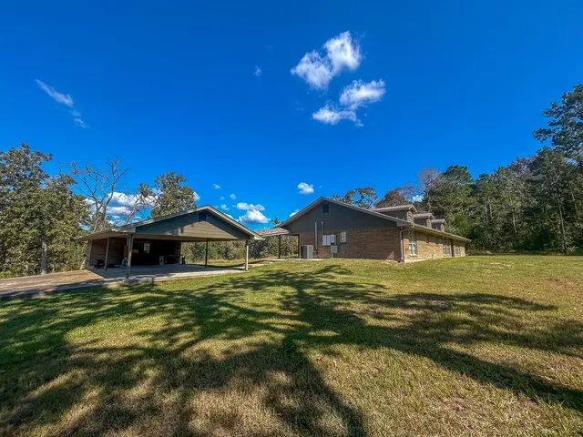 a view of a house with a big yard
