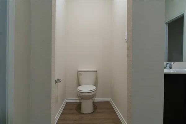a bathroom with a toilet and a sink