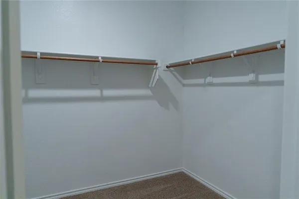 a view of an empty walk in closet