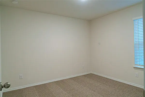 a bedroom with a bed and a table