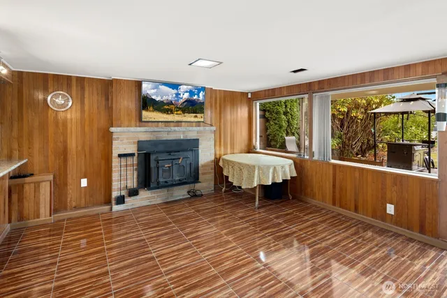 a kitchen with stainless steel appliances granite countertop wooden floors and sink
