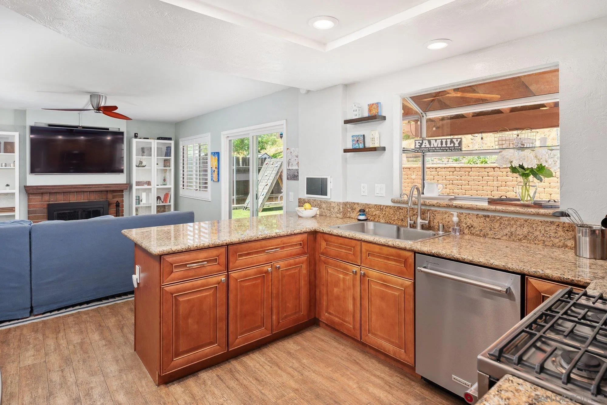 10246 Princess Joann Road Santee, CA 92071 - Photo 17 of 48 a kitchen with stainless steel appliances granite countertop a stove and a sink