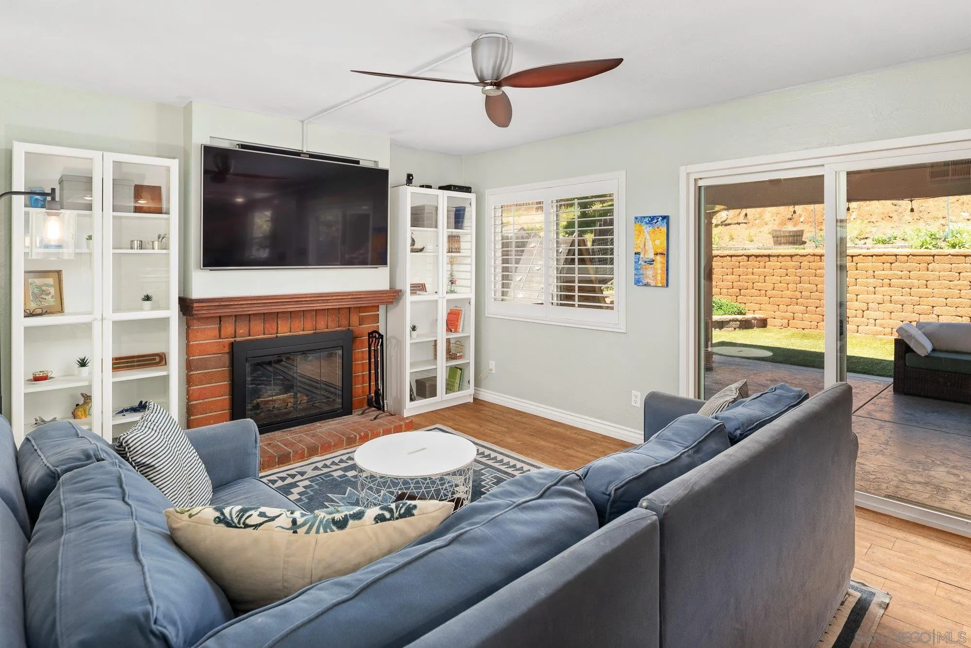 10246 Princess Joann Road Santee, CA 92071 - Photo 18 of 48 a living room with furniture fireplace and flat screen tv