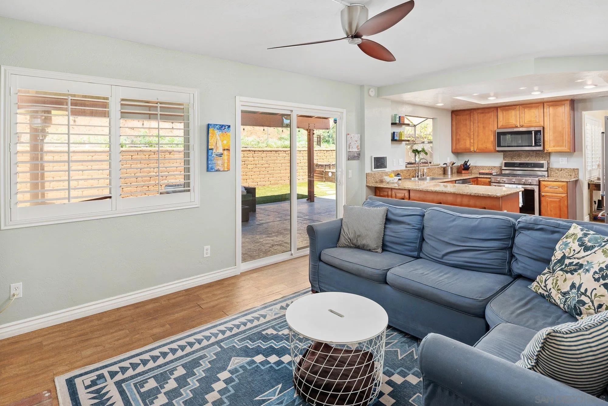 10246 Princess Joann Road Santee, CA 92071 - Photo 20 of 48 a living room with furniture and a large window