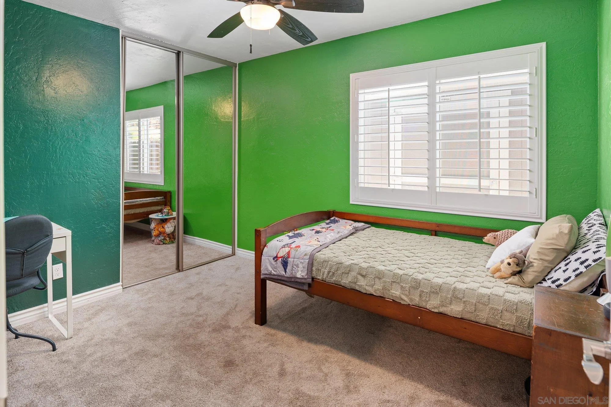 10246 Princess Joann Road Santee, CA 92071 - Photo 21 of 48 a bed sitting in a bedroom next to a window