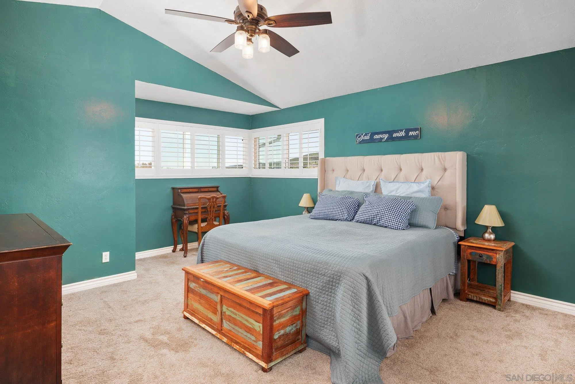 10246 Princess Joann Road Santee, CA 92071 - Photo 23 of 48 a bed room with a bed and a chandelier