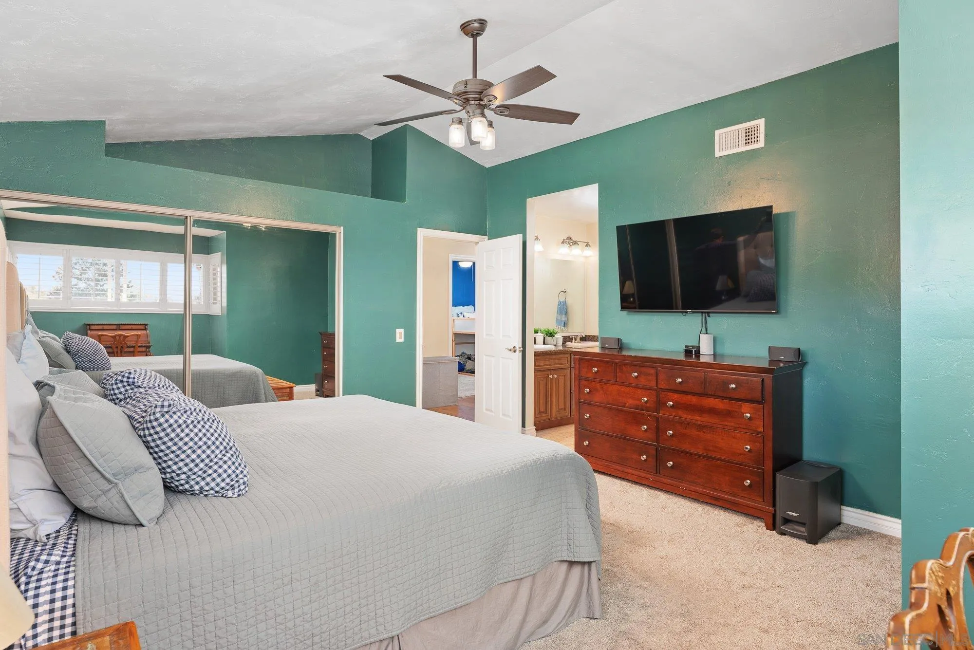 10246 Princess Joann Road Santee, CA 92071 - Photo 24 of 48 a bedroom with a bed and a flat screen tv