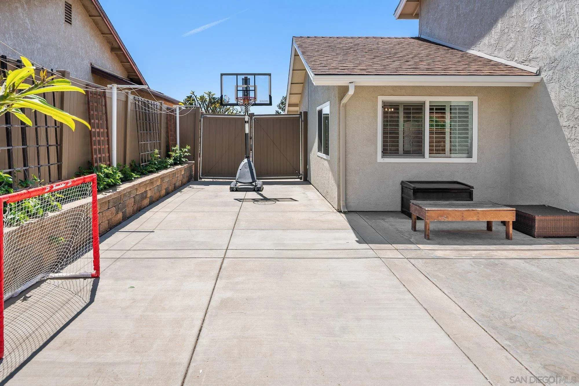 10246 Princess Joann Road Santee, CA 92071 - Photo 33 of 48 a backyard of a house with sofas fire pit and outdoor seating