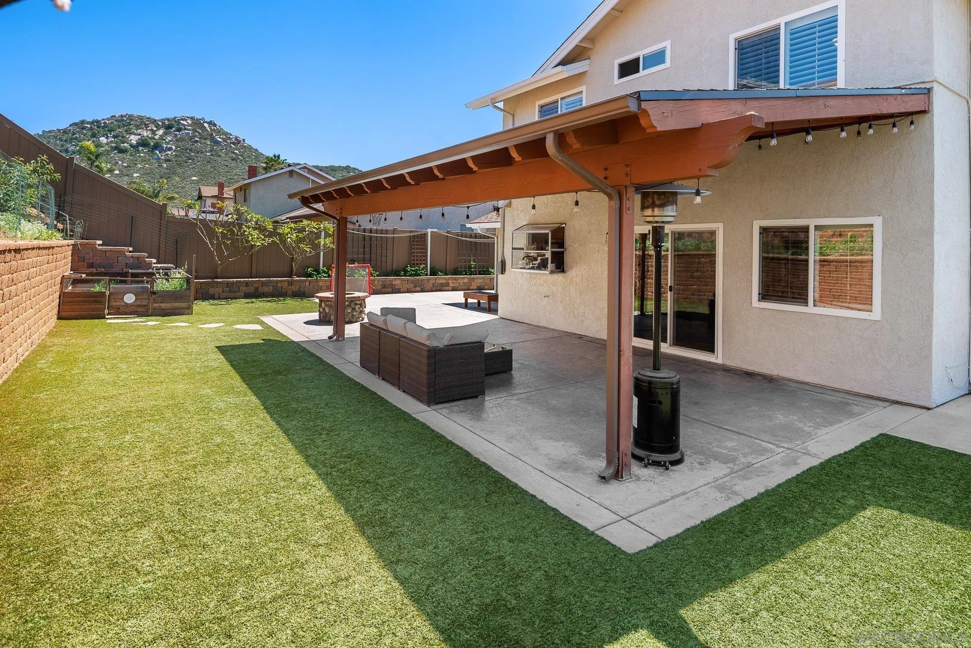 10246 Princess Joann Road Santee, CA 92071 - Photo 37 of 48 a front view of a house with garden