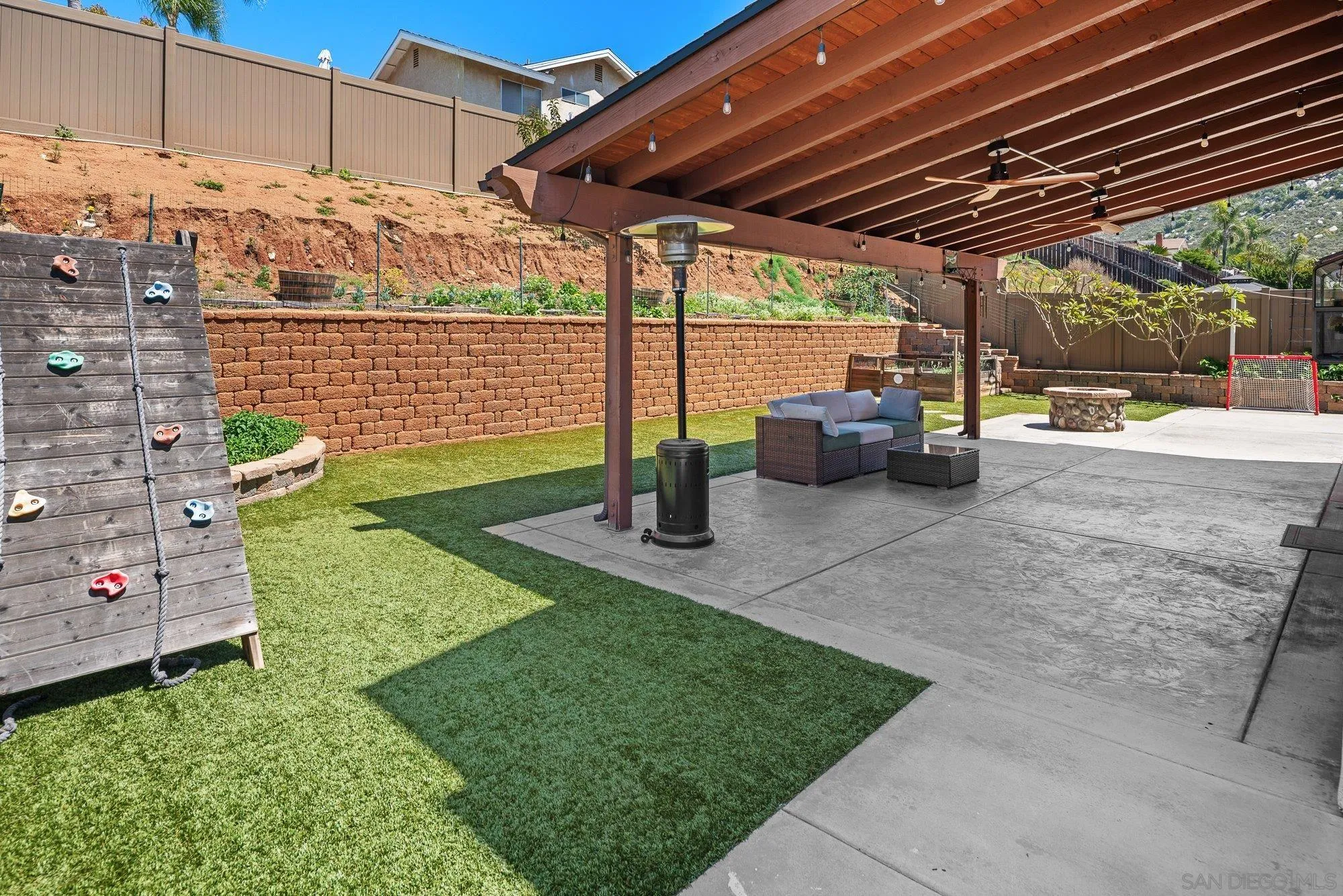 10246 Princess Joann Road Santee, CA 92071 - Photo 38 of 48 a view of a backyard with plants and a patio