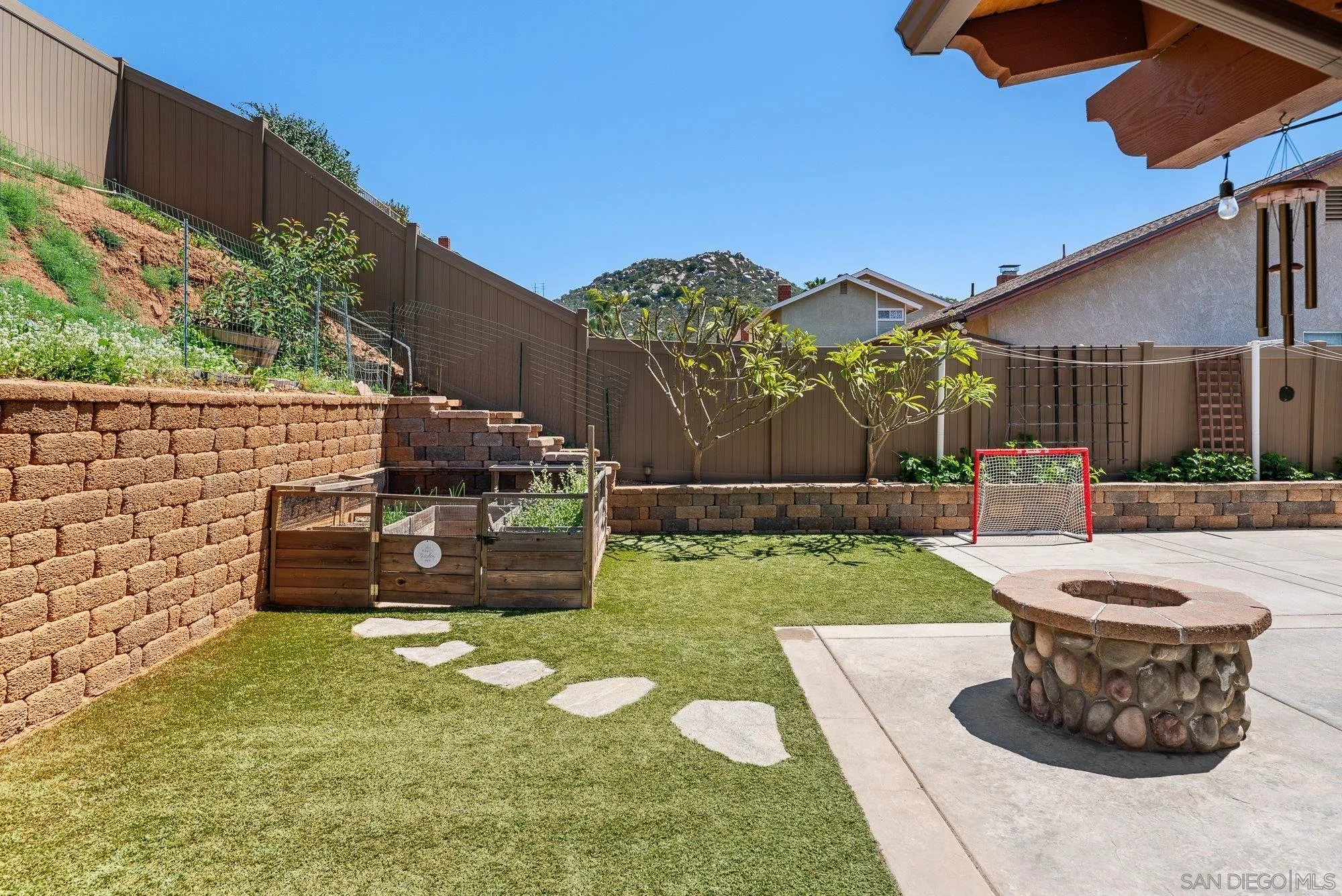 10246 Princess Joann Road Santee, CA 92071 - Photo 40 of 48 a view of a backyard with plants and a patio
