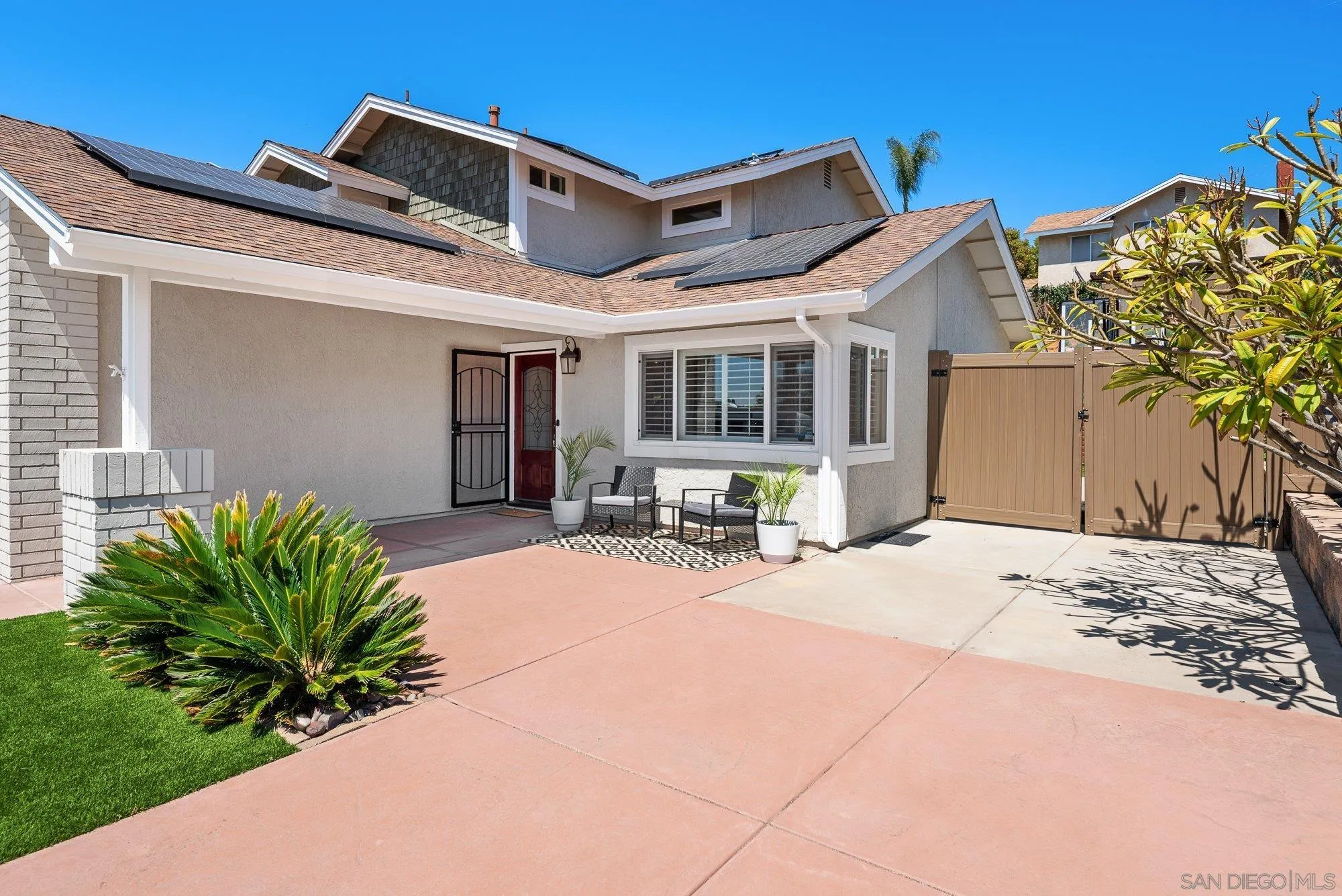 10246 Princess Joann Road Santee, CA 92071 - Photo 6 of 48 a front view of a house with a yard
