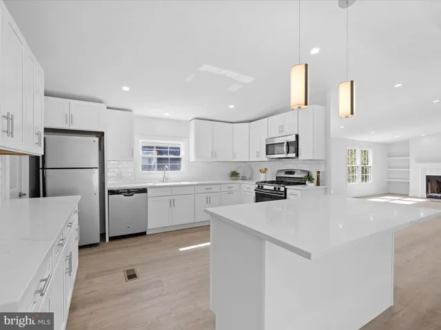 a kitchen with a stove and a microwave