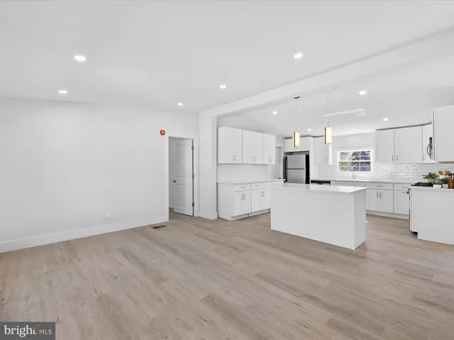 a view of kitchen with wooden floor