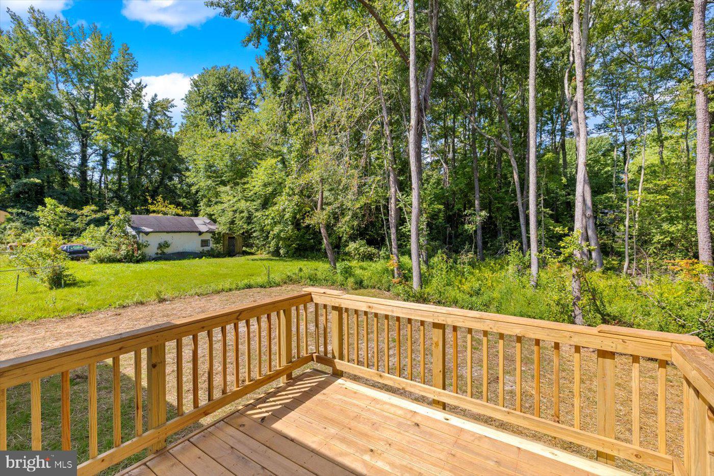 736 Circle Lane Colonial Beach, VA 22443 - Photo 2 of 40 a view of a wooden deck with a yard