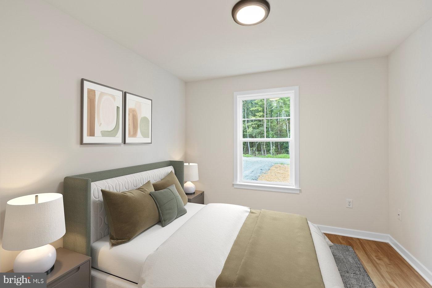 736 Circle Lane Colonial Beach, VA 22443 - Photo 8 of 40 a bedroom with a bed and window