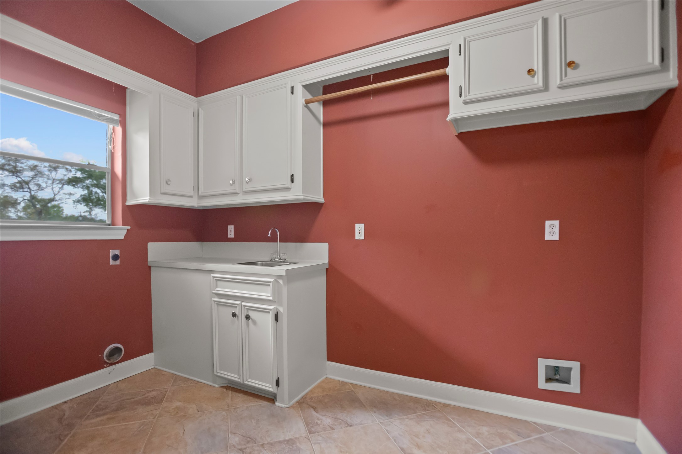 22916 East Martin Drive Porter, TX 77365 - Photo 32 of 43 a kitchen with white cabinets and a refrigerator