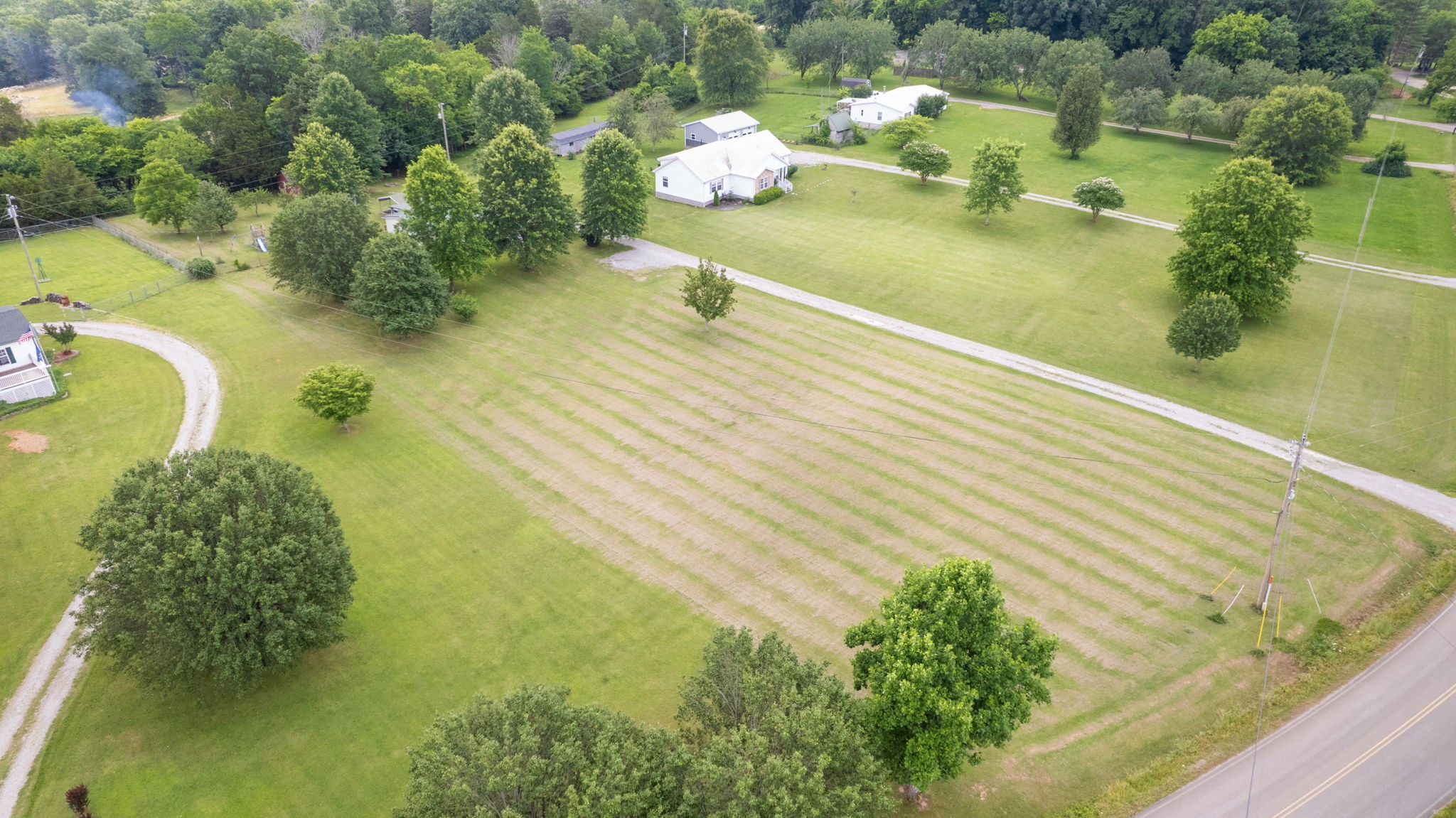 2132 Lasea Road Spring Hill, TN 37174 - Photo 24 of 26 a swimming pool with some trees in the background