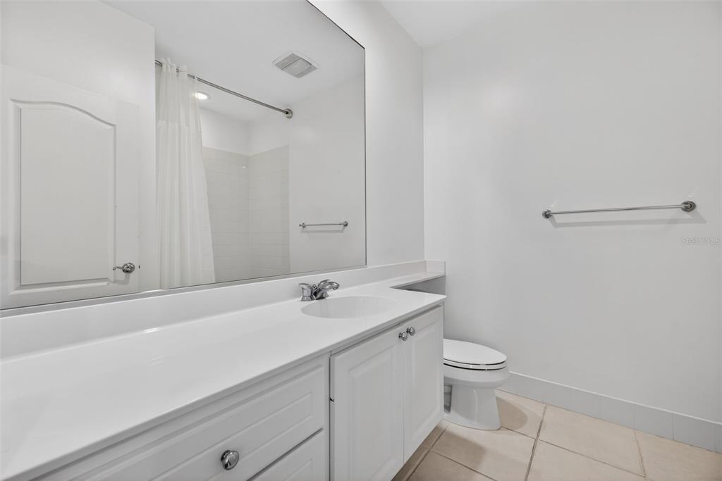 3518 Zanzibar Way Naples, FL 34119 - Photo 25 of 44 a bathroom with a sink a toilet and vanity