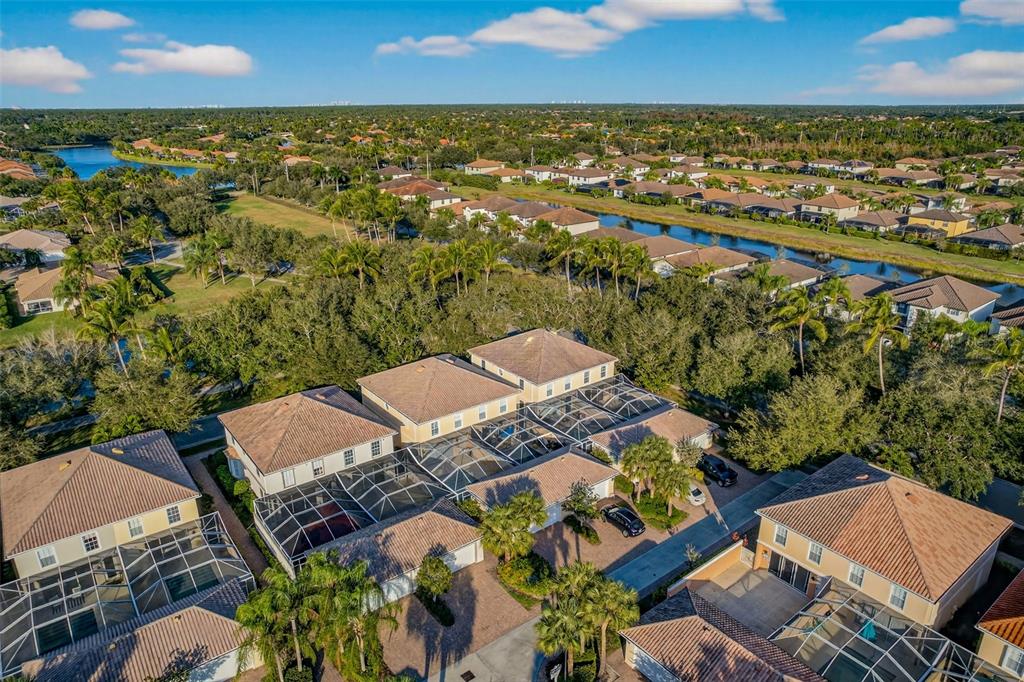 3518 Zanzibar Way Naples, FL 34119 - Photo 32 of 44 an aerial view of residential houses with outdoor space