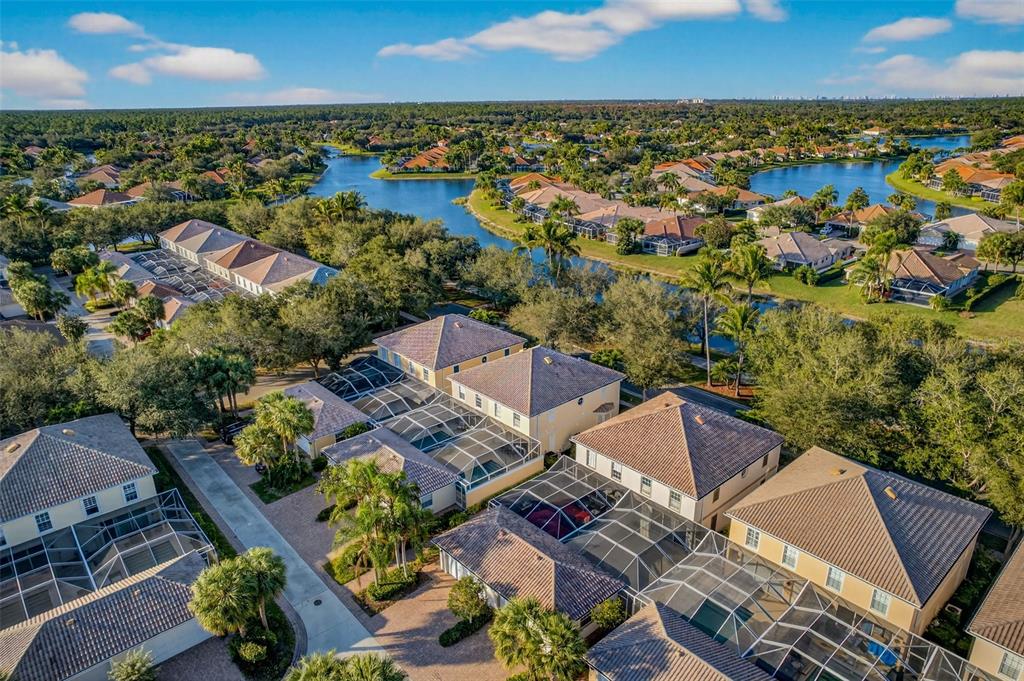 3518 Zanzibar Way Naples, FL 34119 - Photo 34 of 44 an aerial view of residential houses with outdoor space