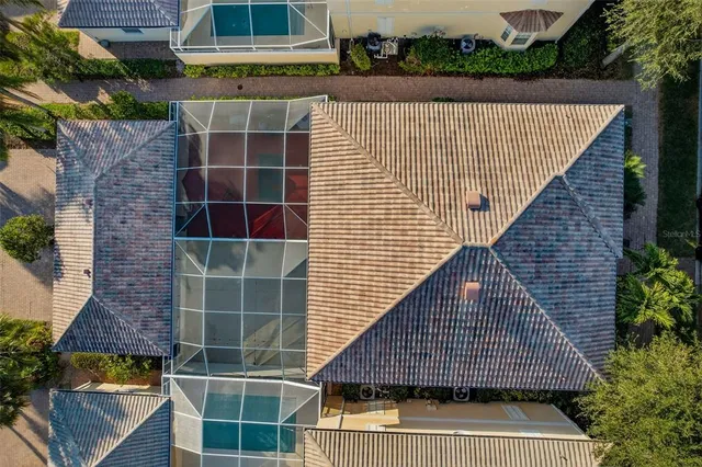 an aerial view of houses with a yard