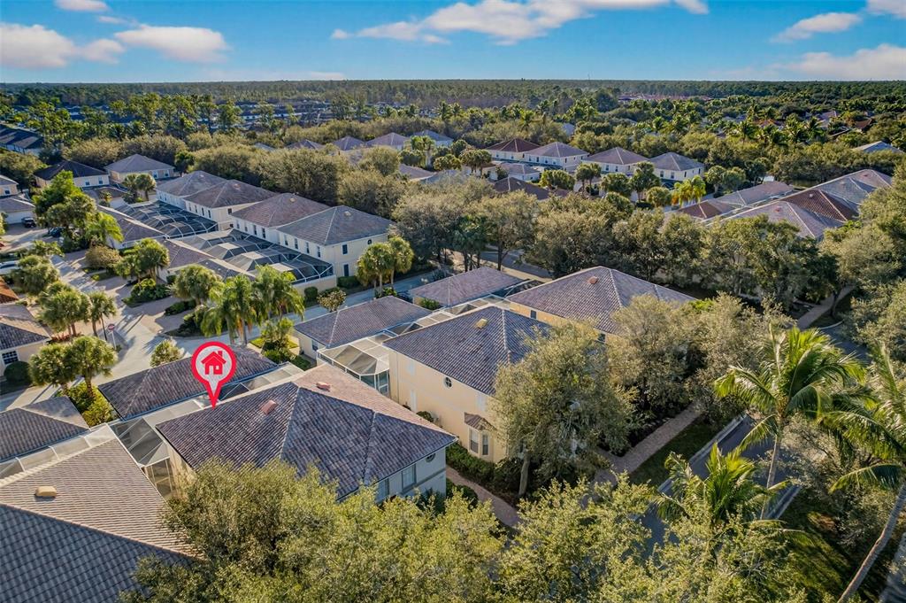 3518 Zanzibar Way Naples, FL 34119 - Photo 42 of 44 an aerial view of residential houses with outdoor space