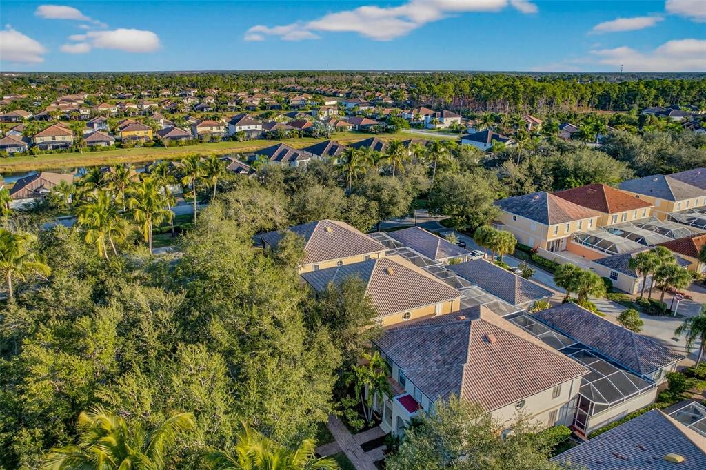 3518 Zanzibar Way Naples, FL 34119 - Photo 43 of 44 an aerial view of residential houses with outdoor space